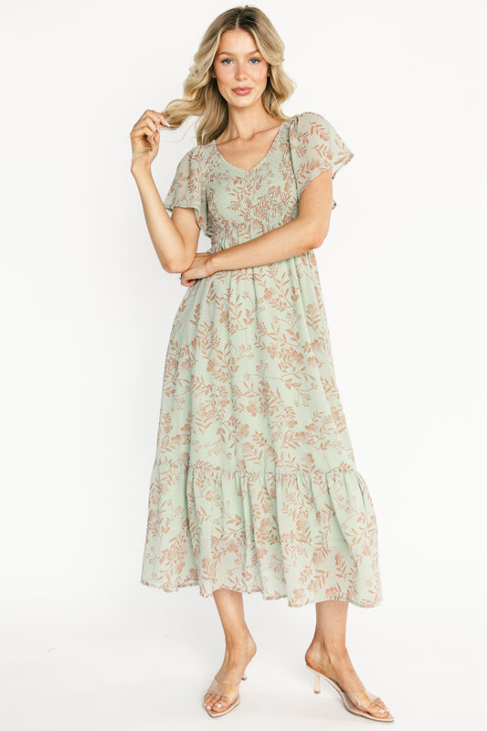 Front view of Monica Smocked Maxi Dress in dusty sage with terracotta floral print, V-neck, smocked bodice and flutter sleeves.