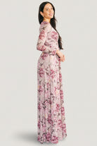 Model seated in Fable Mesh Maxi Dress showing maxi length, flow, and how the dress moves for occasion wear.