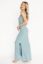 Side view of Desi Shimmer gown displaying fitted waist, right side zipper, and smooth fully lined interior for comfort.