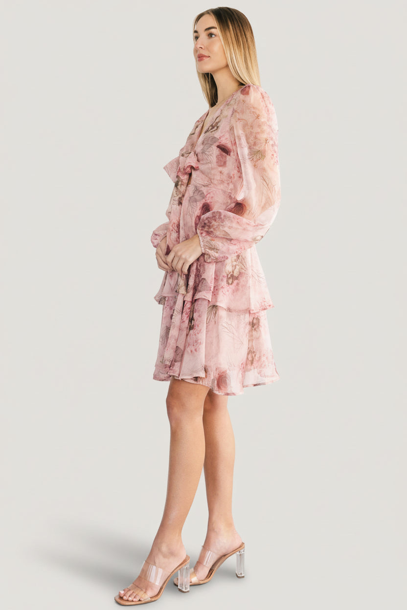 Video still of Zoemy dress movement: airy polyester fabric, tiered hem, and soft rose pink floral pattern for occasion wear.