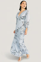 Studio shot of the Beckham Maxi Dress displaying overall silhouette, pleated bust detail, waist tie and floral placement.