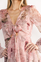 Back view of Zoemy short dress highlighting elastic back waist, lined back bodice, and tiered mini silhouette.