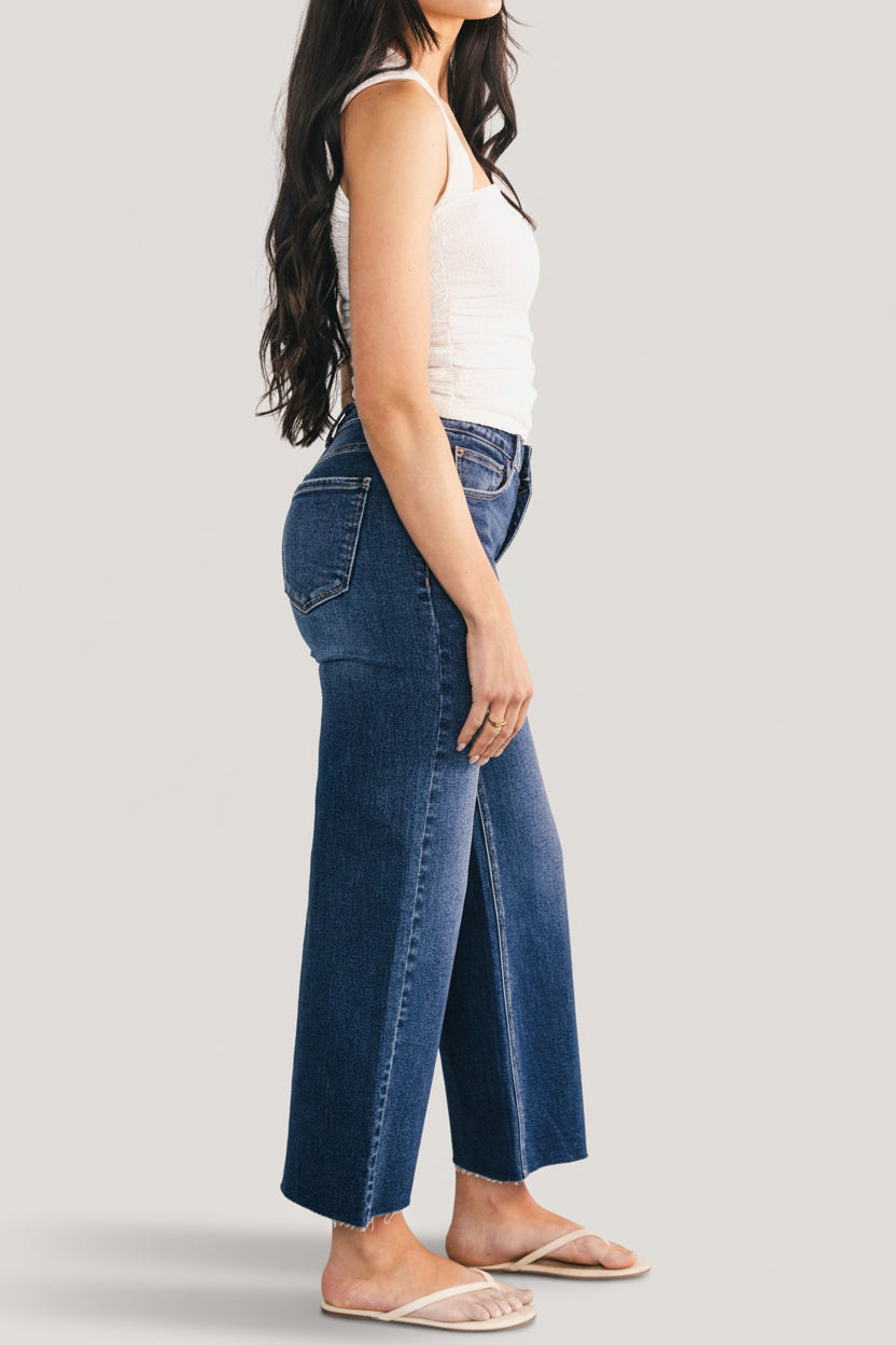 Styled outfit photo featuring the Kirby high-rise wide-leg jeans in dark wash paired with a lightweight top to show proportion and styling options.
