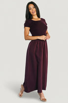 Close-up of ribbed sweater-knit top on Angelique Dress, showing soft stretch texture and neat round neckline in mulberry