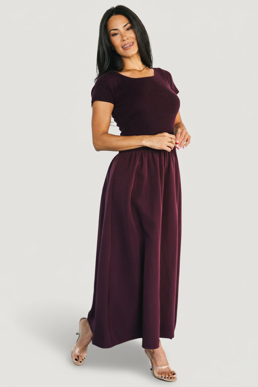 Close-up of ribbed sweater-knit top on Angelique Dress, showing soft stretch texture and neat round neckline in mulberry