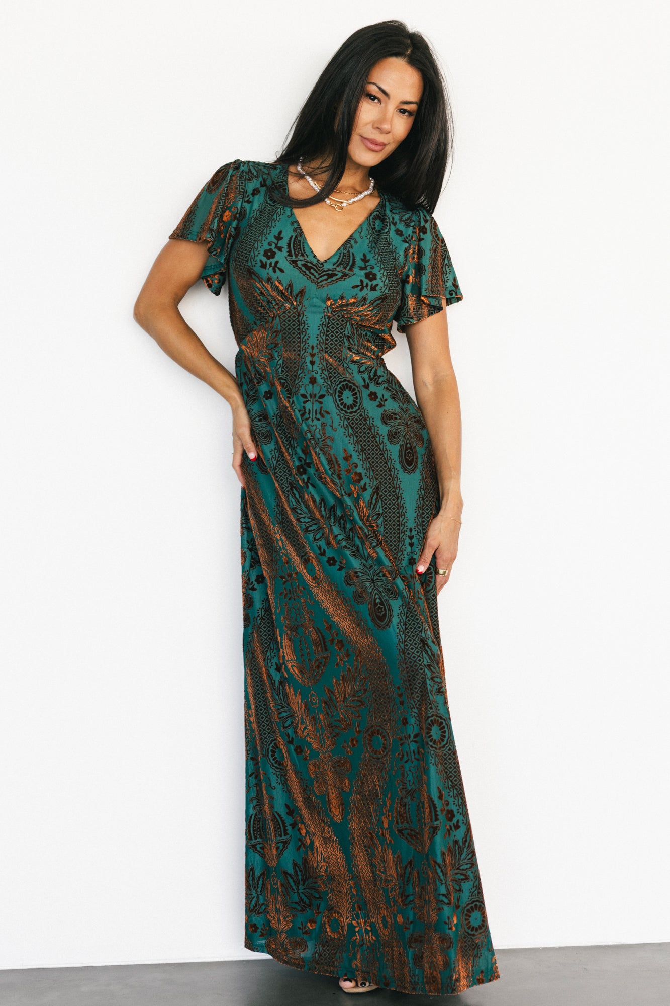 Back and side profile of the Kimberly maxi dress displaying the empire seam and graceful hem movement.