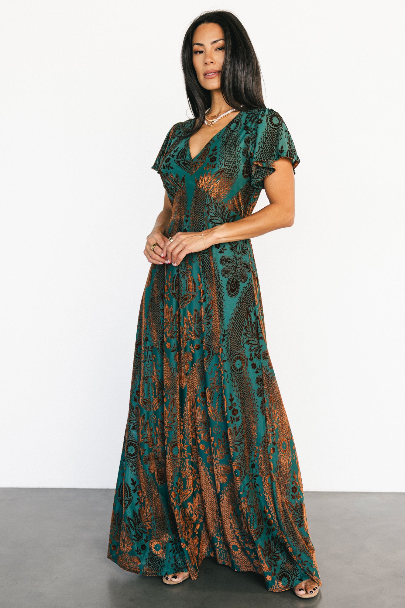 Styled flat-lay and hanging shot of the Kimberly velvet maxi dress showing full length, lining, and velvet pattern.