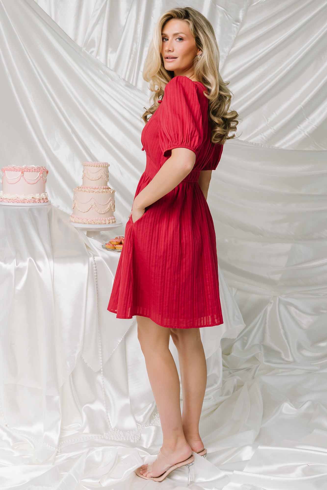 Styled outfit: Hayley Short Dress in dusty red paired with sandals and light jacket, illustrating casual-to-dressy versatility.