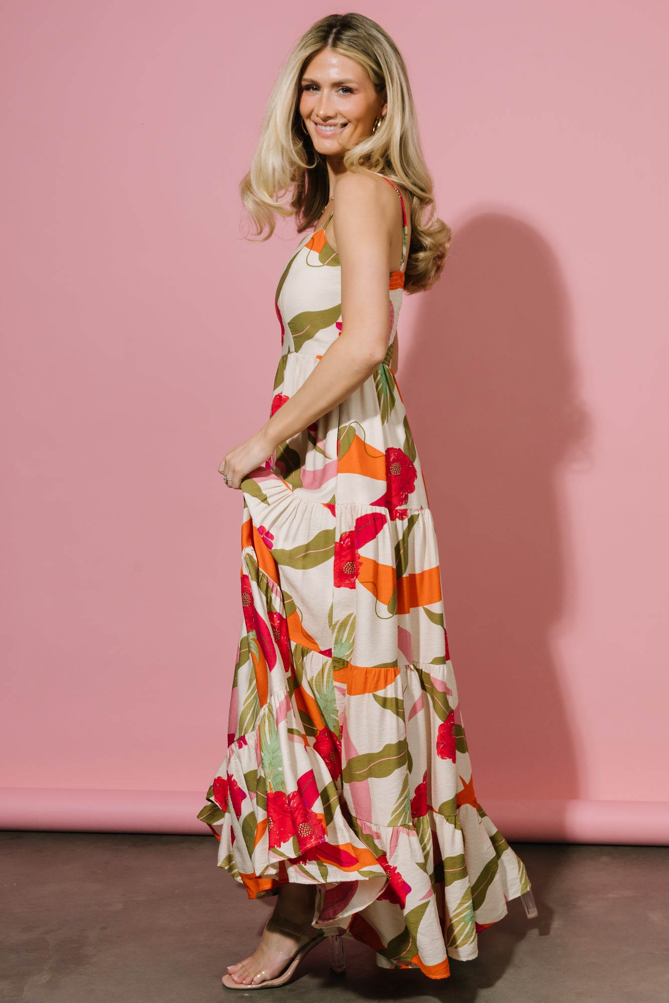 Detail image of tiered skirt and hidden side seam pocket illustrating functional design and layered silhouette.
