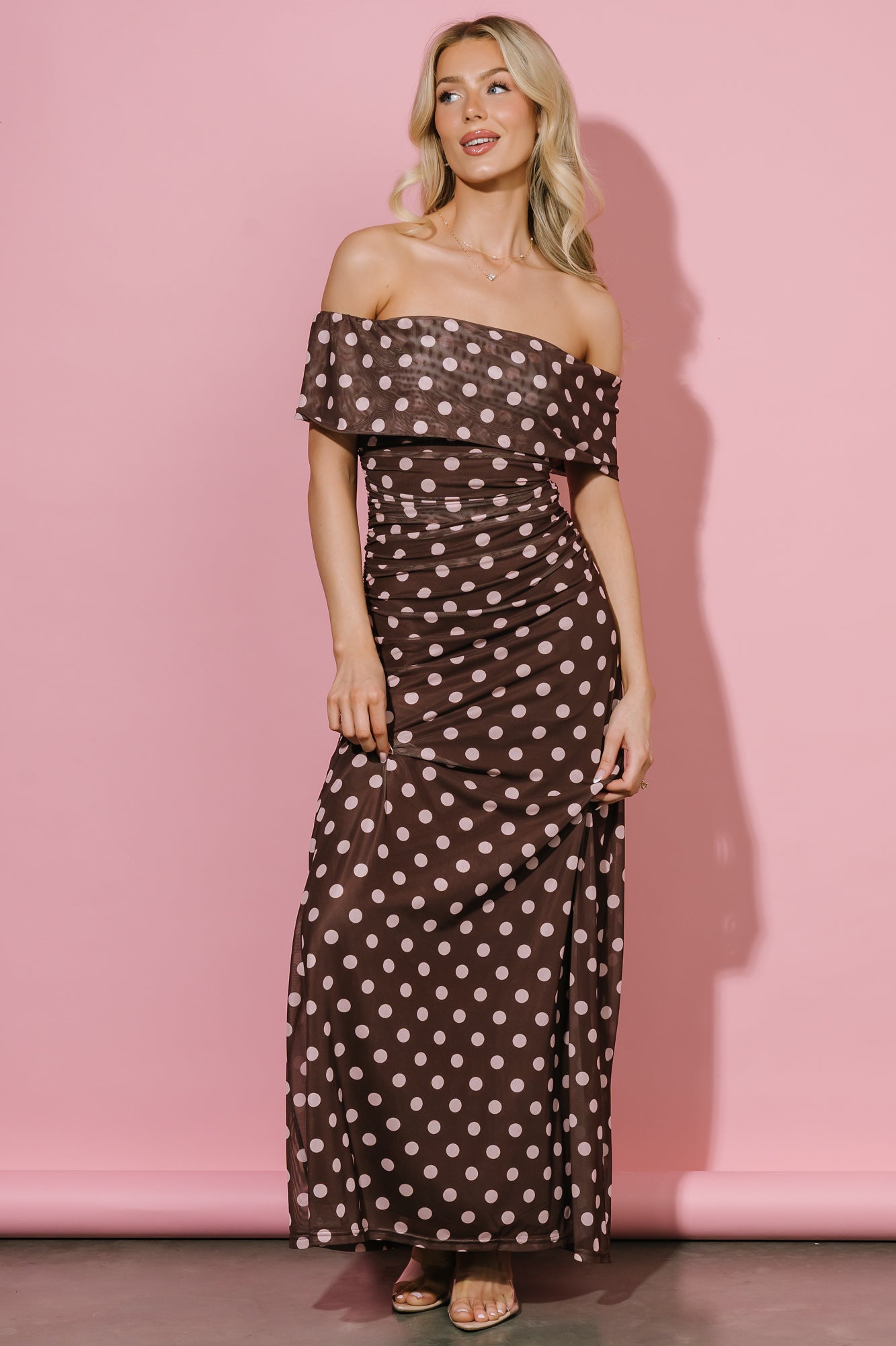 Close-up of off-shoulder neckline and silicone grip lining on the Maisie dress, with visible polka-dot mesh texture and seam detail.