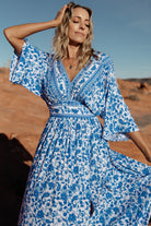 Side view of the Watson kimono maxi dress on model, highlighting V-neck, kimono sleeves and flowing maxi length.