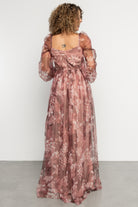 Close-up of sheer bishop sleeve and ivory floral print on deep mauve tulle, showing elastic shoulder and cuff details.