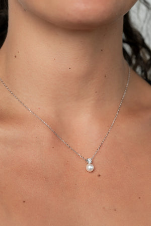 Addilyn Pearl Necklace in Silver with freshwater pearl pendant, moissanite accent, and delicate silver-tone chain.