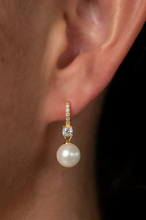 Isabella Pearl Hoop Earrings with lustrous pearl accents and a polished gold-plated finish.