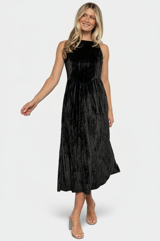 Front view of black crinkled velvet midi dress with high square neckline and V-waistline.