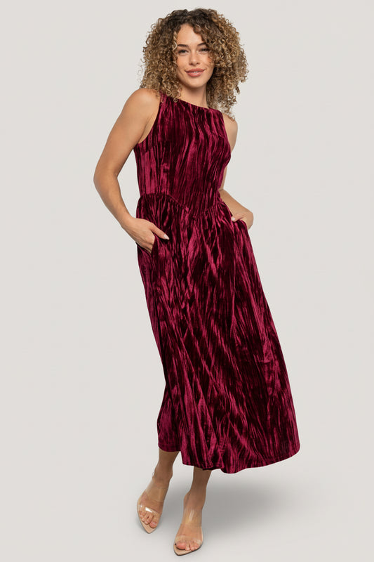 Front view of Octavia Velvet Midi Dress in cranberry; crinkled velvet, high square neckline, midi length, hidden side pockets visible.