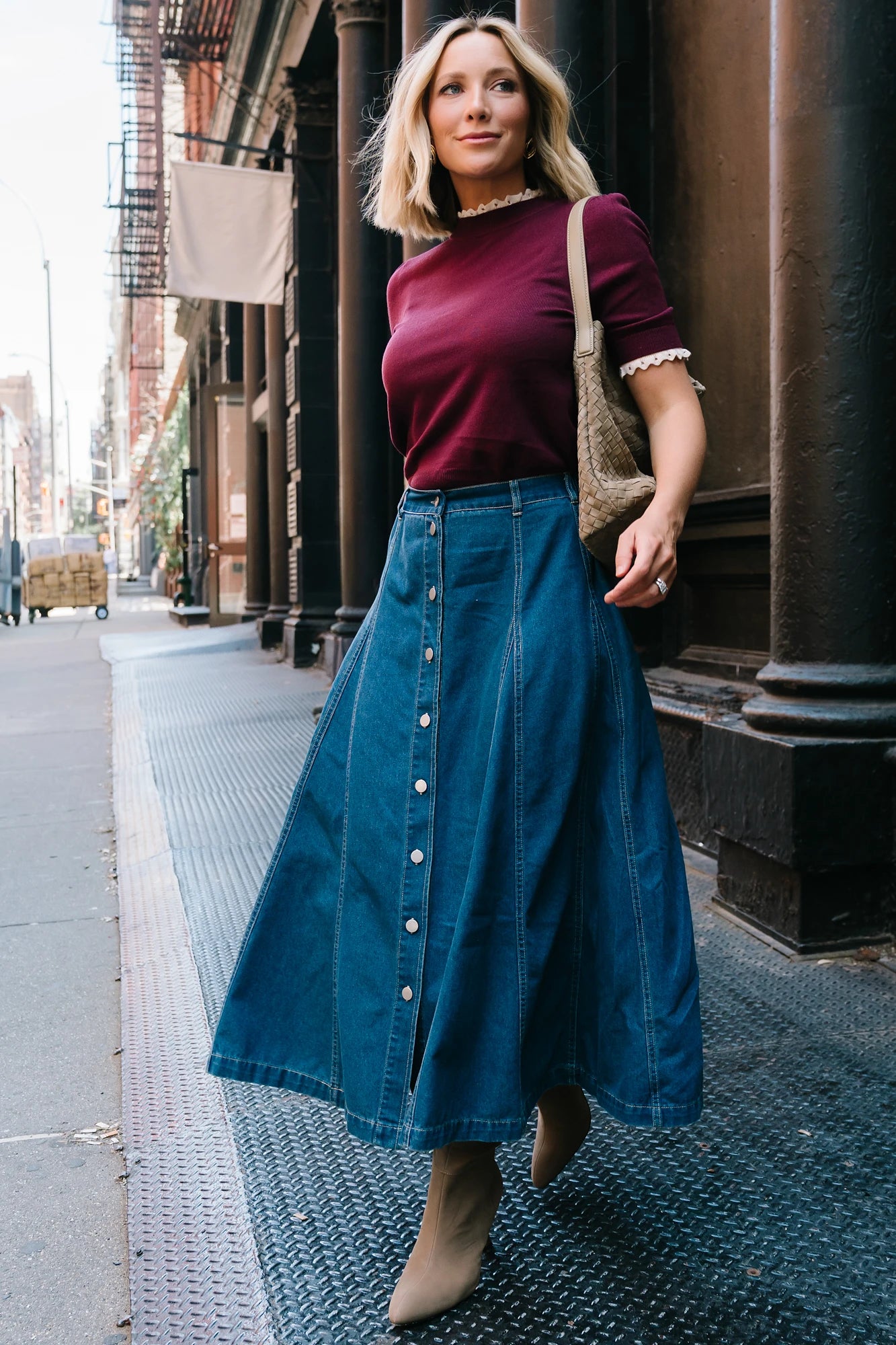 Model wearing the Adeline Sweater Top in Wine featuring a mock neckline, short sleeves with gathered shoulders, contrast ivory eyelet ruffle trim at the neckline and cuffs, and a classic fitted knit silhouette.