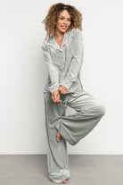 Front view of Klara ribbed velvet pajama set in light sage showing collared V-neck top and relaxed wide-leg pants.