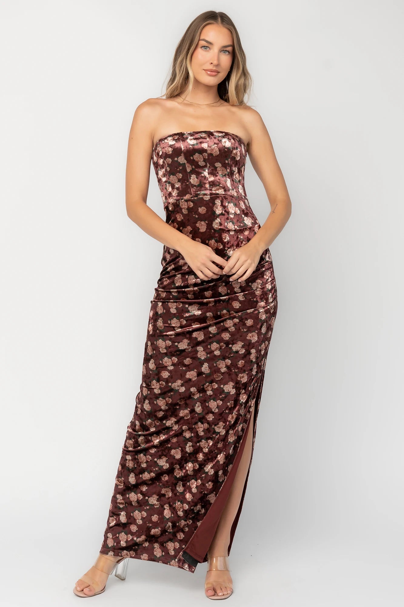 Berry floral velvet strapless maxi dress with side ruching, thigh-high slit, silicone grip neckline, and hidden back zipper.