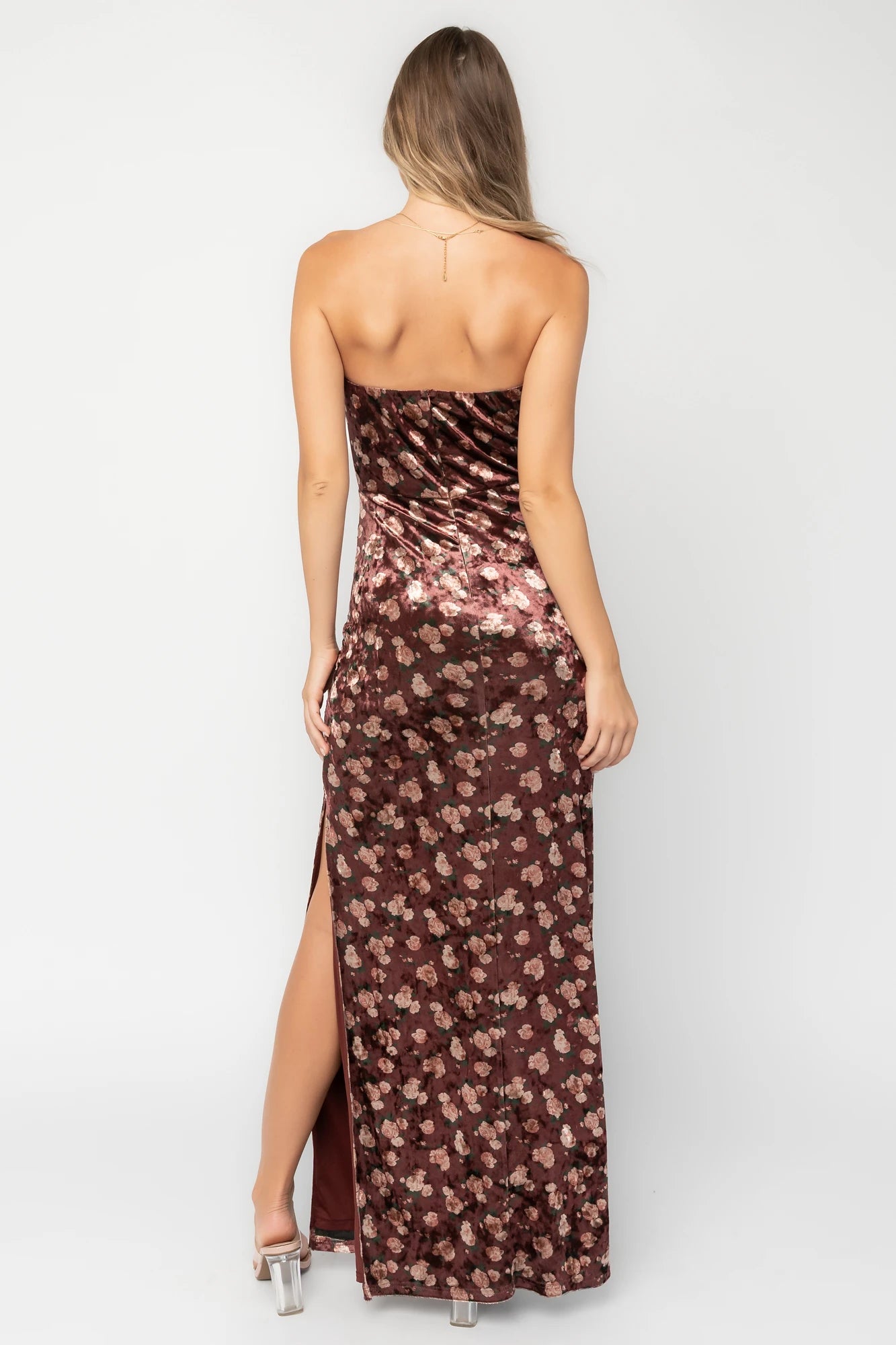 Berry floral velvet strapless maxi dress with side ruching, thigh-high slit, silicone grip neckline, and hidden back zipper.