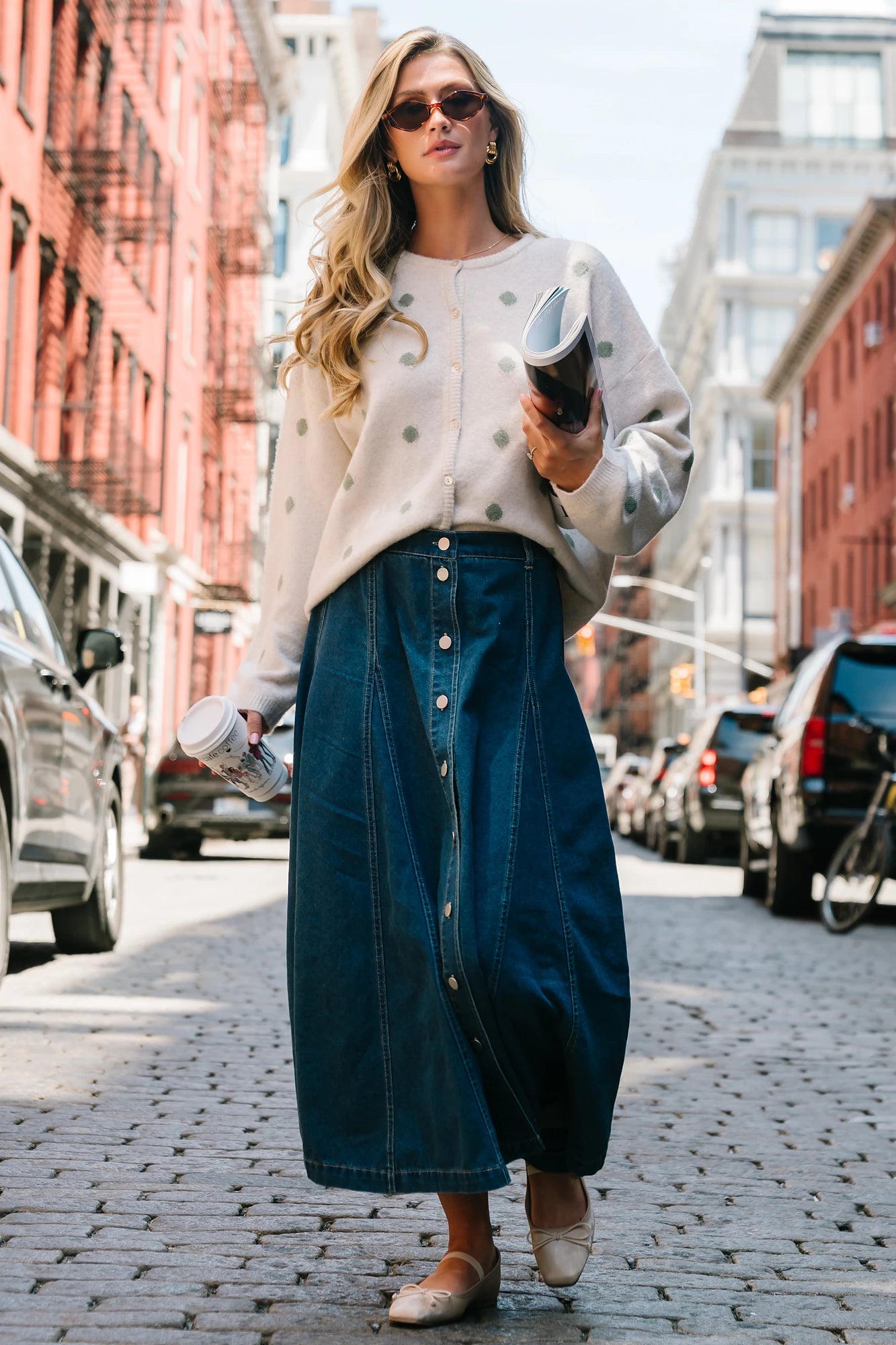 Model wearing the Cece Button-Down Denim Skirt in a dark wash featuring a button-front placket, elastic back waist, and a classic knee-length silhouette.