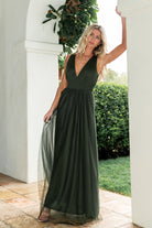 Back and side view of Juniper Green Kamila Tulle Maxi Dress highlighting flowing skirt, layered tulle, and silhouette from behind.