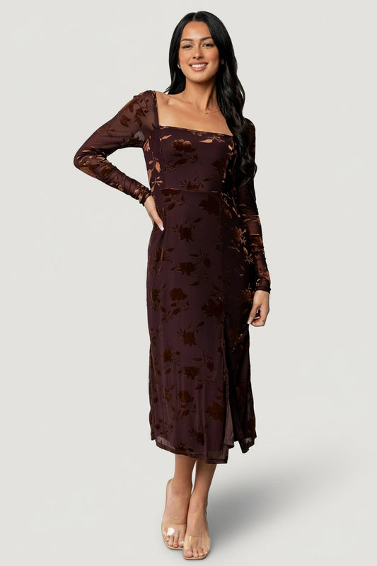 Three-quarter side view: Tamara Midi Dress showing fitted bodice, left leg slit, and flowing midi skirt in deep plum.