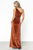 Close-up of velvet fabric and neckline showing rich bronze pile, single-shoulder strap, and smooth seaming at the bodice for a tailored fit.