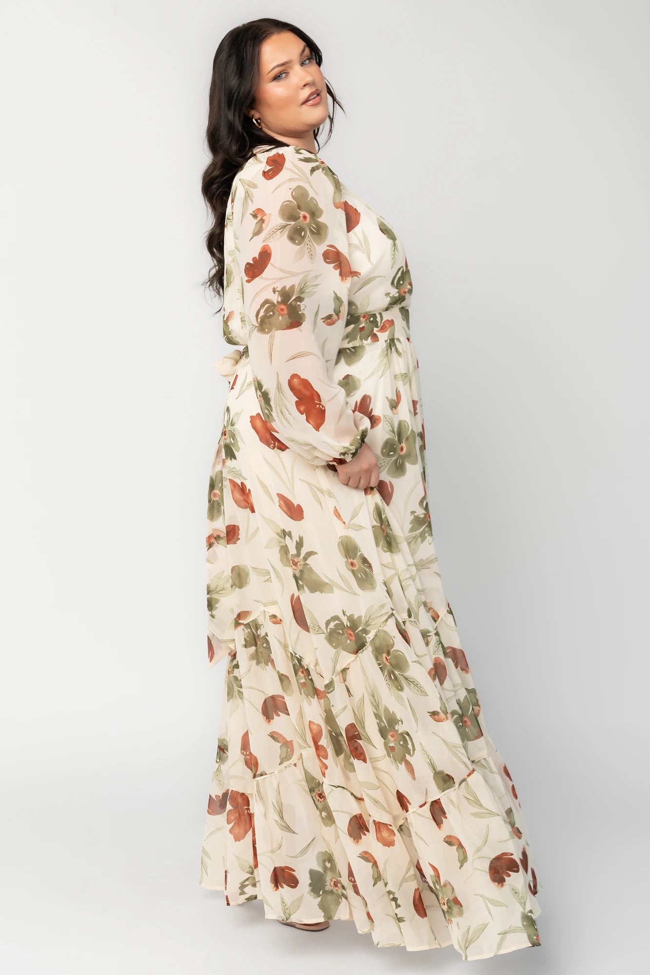 Cream Floral Chiffon Maxi Dress with rust and green florals, surplice neckline, long sleeves, waist ties, and tiered skirt.