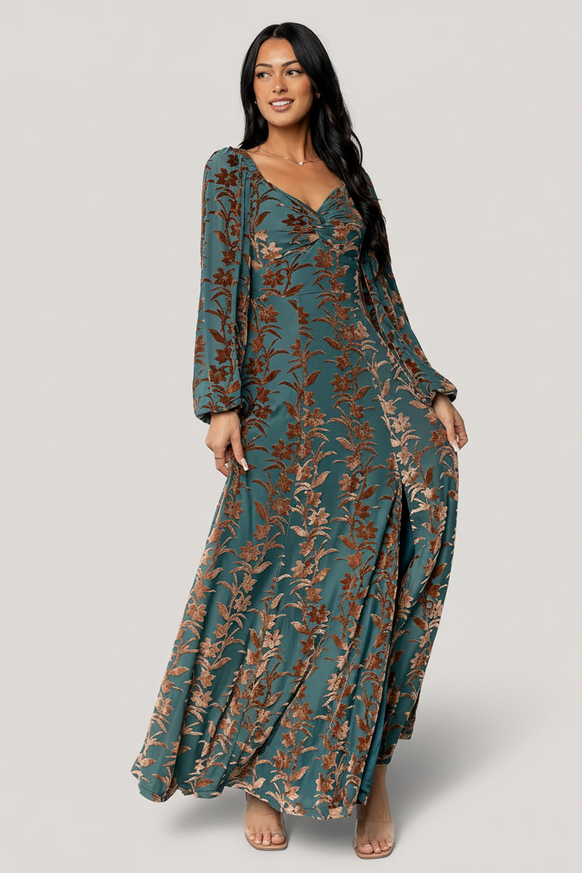 Model wearing Aurora Velvet Maxi Dress in Jade & Bronze Floral, front view showing sweetheart neckline and maxi skirt.