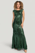 Studio view of Alessia gown laid to show embroidered sequin pattern across the skirt and the gown's floor-length mermaid cut.
