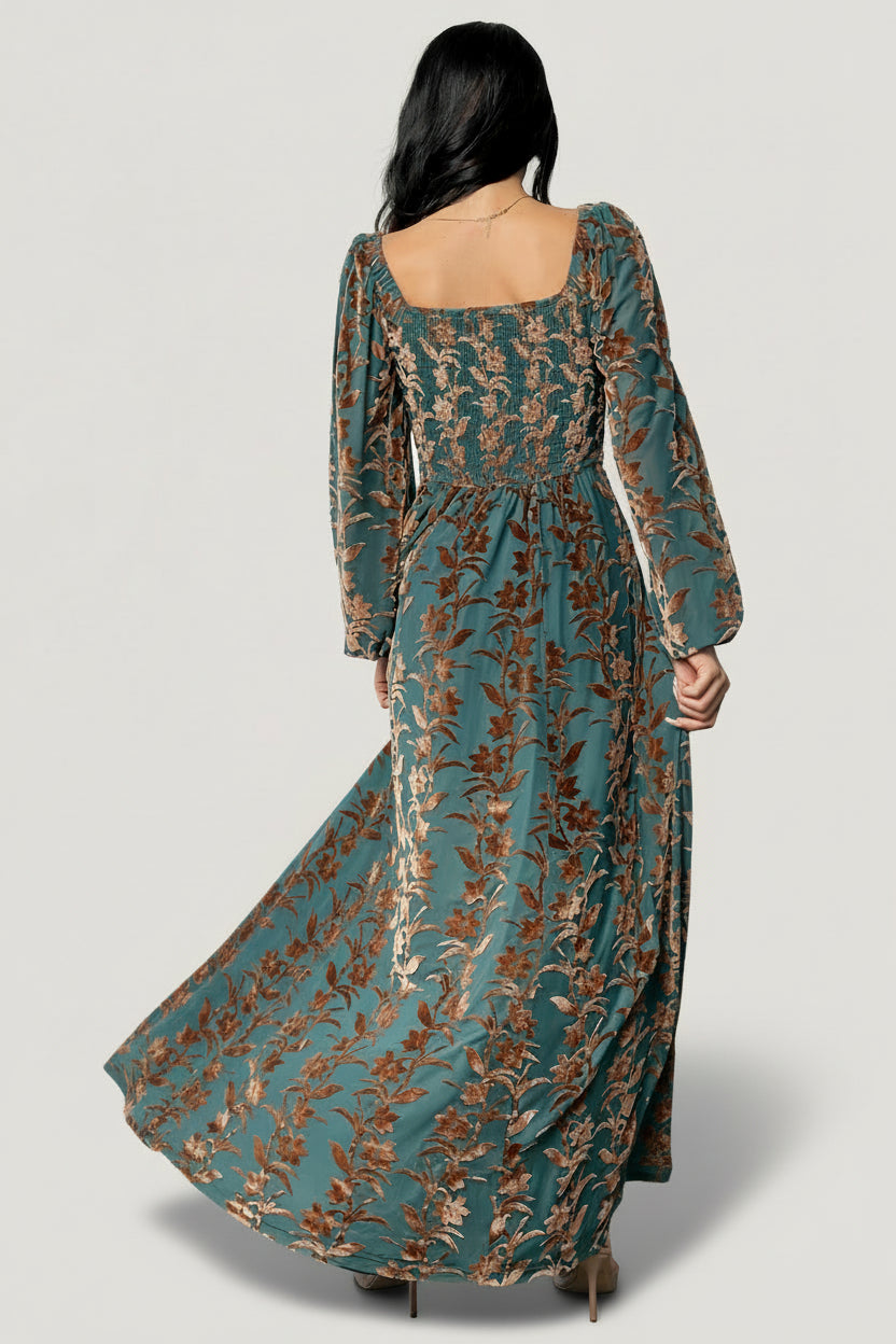Close-up of velvet burnout floral pattern and fabric texture on the Aurora Velvet Maxi Dress in Jade & Bronze tones.