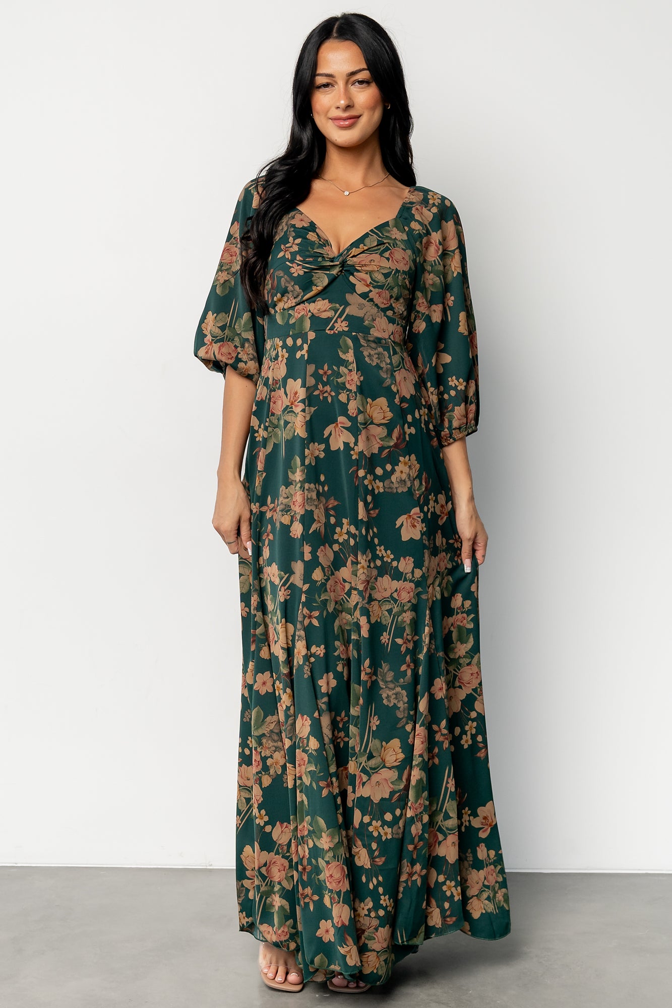Back view highlighting smocked back panel, up-pointed paneled high waist, and smooth lining under the skirt.