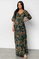 Styled product shot on white background showing full silhouette, print scale, and the dress's lightweight drape.