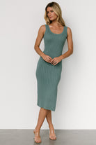 Close-up detail of Rue Ribbed Midi Dress in eucalyptus showing wide rib texture, stitch detail around the neckline, and stretch in the fabric.