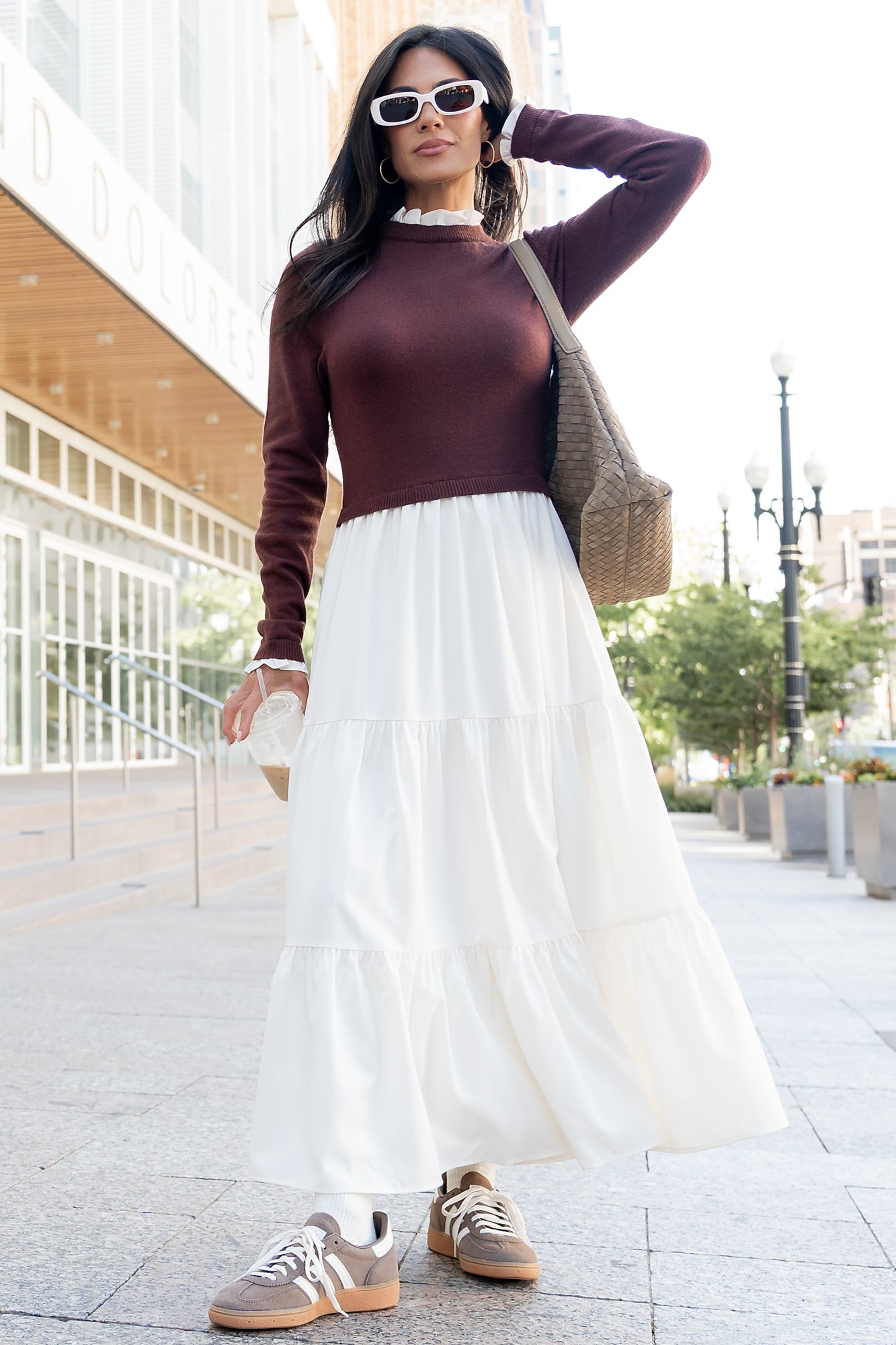 Detail shot of the Sophie Sweater Dress skirt and pocket area in mahogany and ivory, showing fabric texture and seam placement for the hidden pocket.