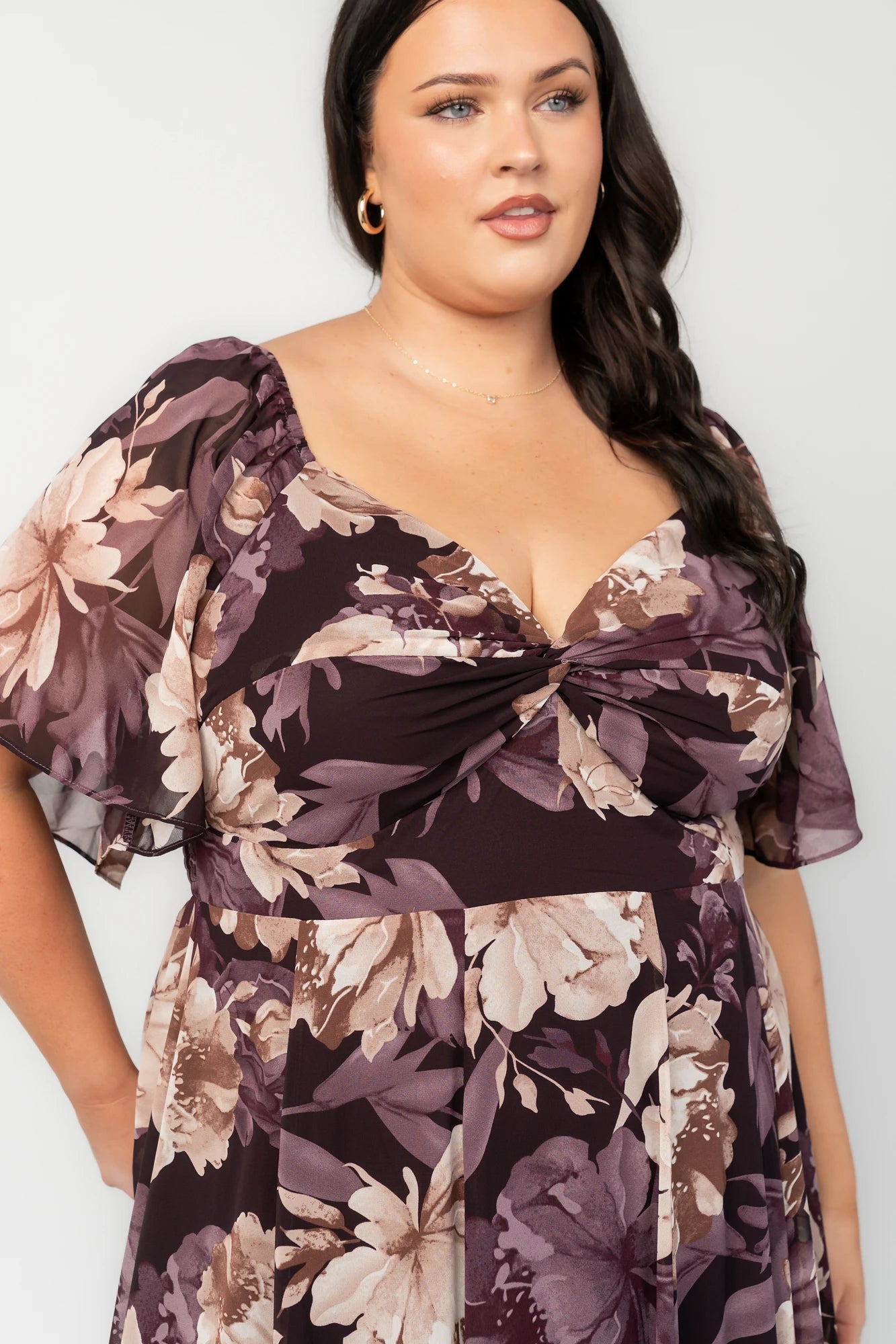 Positano Maxi Dress in Dusty Plum Floral with sweetheart neckline, flutter sleeves, smocked back, and tiered skirt.