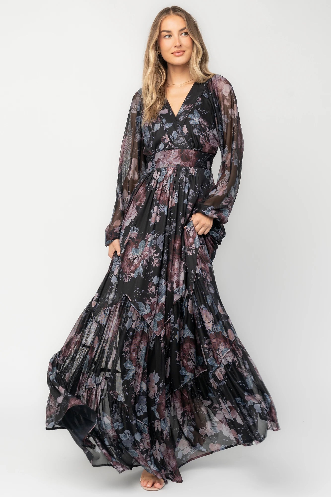 Midnight floral mesh maxi dress with sheer long sleeves, surplice V-neck, elastic waist with self-tie belt, tiered skirt, and keyhole back.