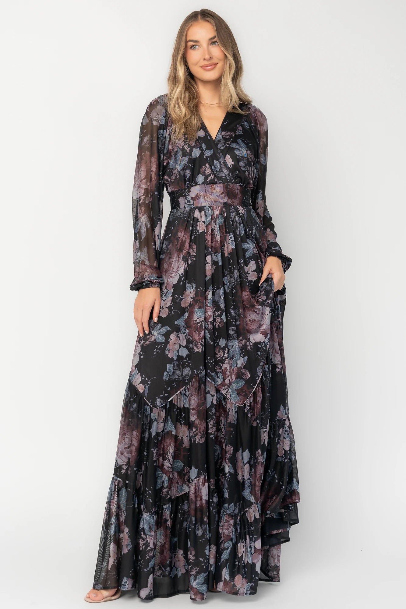 Midnight floral mesh maxi dress with sheer long sleeves, surplice V-neck, elastic waist with self-tie belt, tiered skirt, and keyhole back.