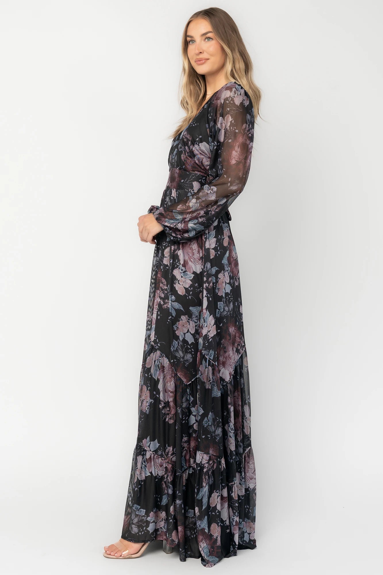 Midnight floral mesh maxi dress with sheer long sleeves, surplice V-neck, elastic waist with self-tie belt, tiered skirt, and keyhole back.