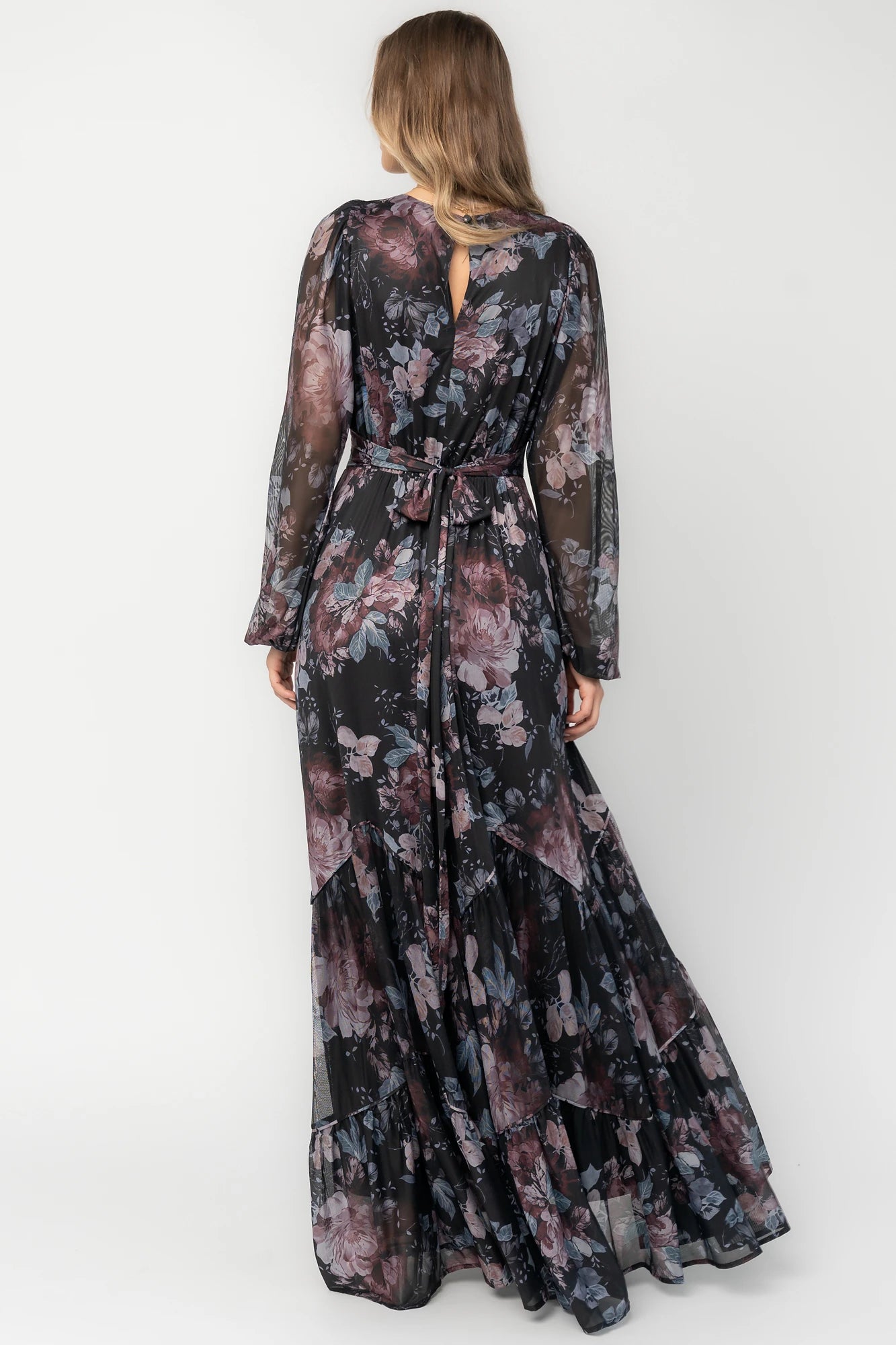 Midnight floral mesh maxi dress with sheer long sleeves, surplice V-neck, elastic waist with self-tie belt, tiered skirt, and keyhole back.