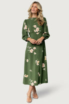 Close-up of the ruffled mock neck and back keyhole button on the Sugar Lips Karalie Maxi Dress in green floral chiffon fabric.