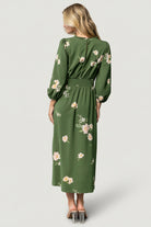 Back view of Sugar Lips Karalie Maxi Dress highlighting the smocked back waist, keyhole closure, and gentle drape of the skirt.