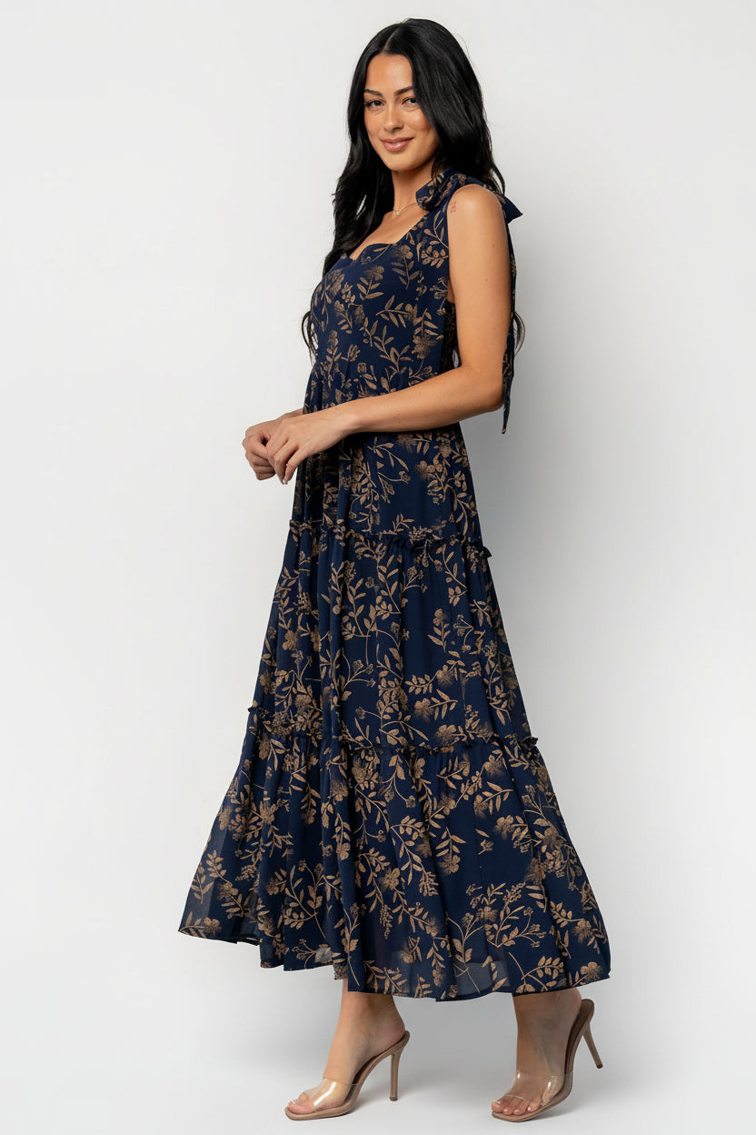 Back view of Anita Maxi Dress displaying the smocked back panel, adjustable straps tied at shoulders, and full lining beneath the chiffon overlay.