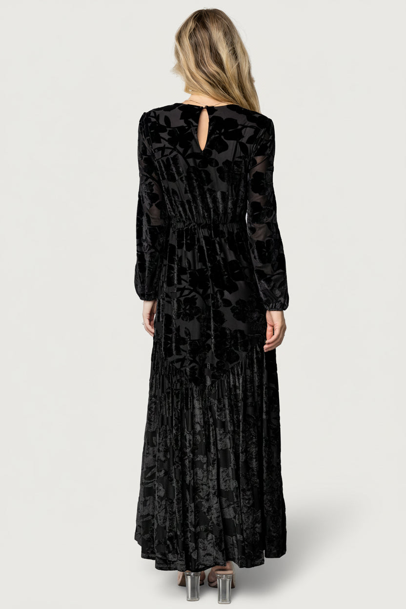 Back view of maxi dress showing elasticized back waist and gentle gathering that shapes the bodice while maintaining a flowing skirt.