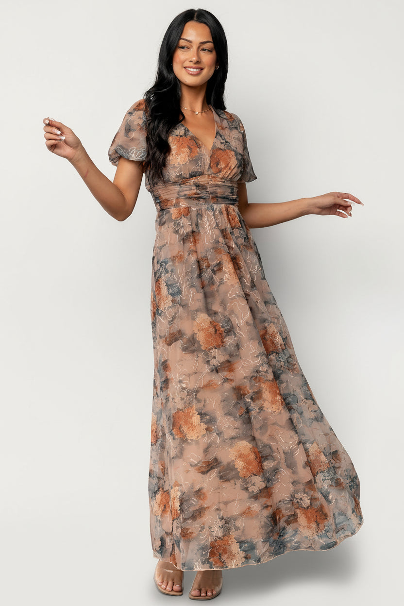 Front view of Ardley Maxi Dress in Copper + Slate Floral showing V-neck, puff sleeves, gathered waist and discreet side pockets on model.