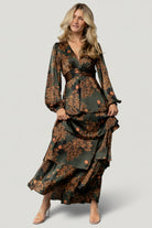 Detail view highlighting bodice lining, under-bust contour panel, and fine seam work of the Montrouge satin tiered maxi dress in olive floral print.