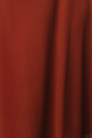 Close-up of Colette chiffon fabric swatch in Cinnamon showing lightweight drape, subtle texture, and true color on a neutral background.