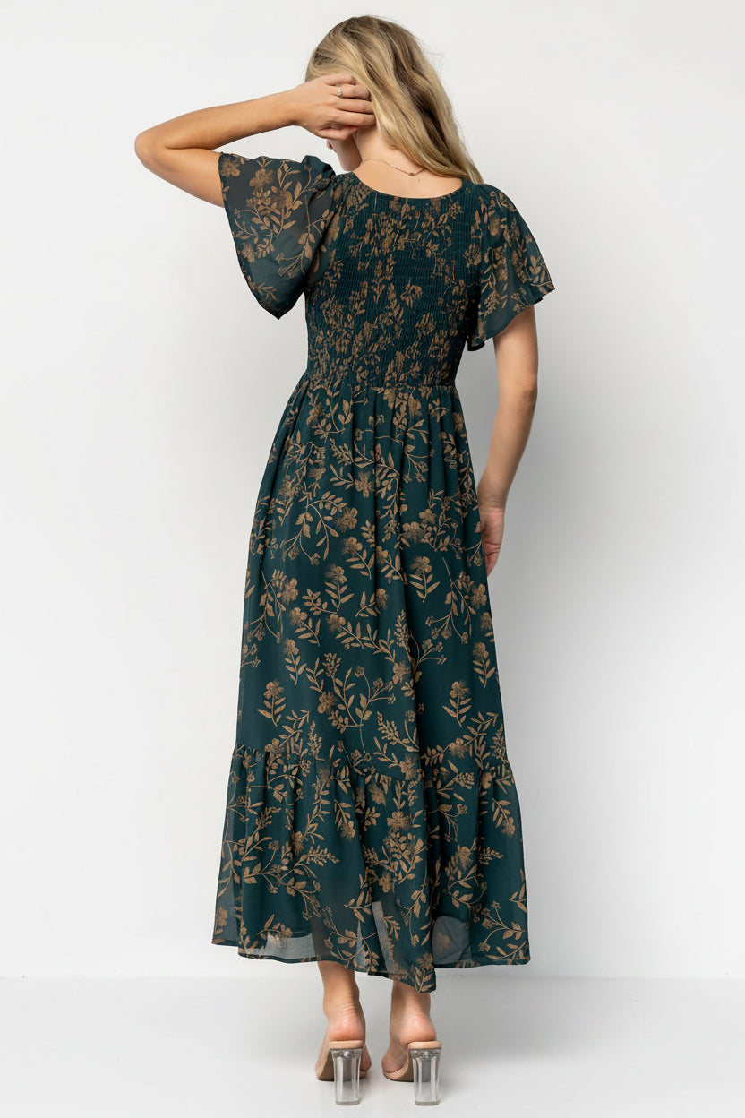 Back and movement shot of the Monica Smocked Maxi Dress in Deep Topaz, showing single-tier hem, fluid skirt motion, and overall silhouette.