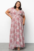 Close-up of Lynlee Metallic Maxi Dress fabric highlighting gold metallic threading over dusty pink floral chiffon, showing texture and delicate shimmer.